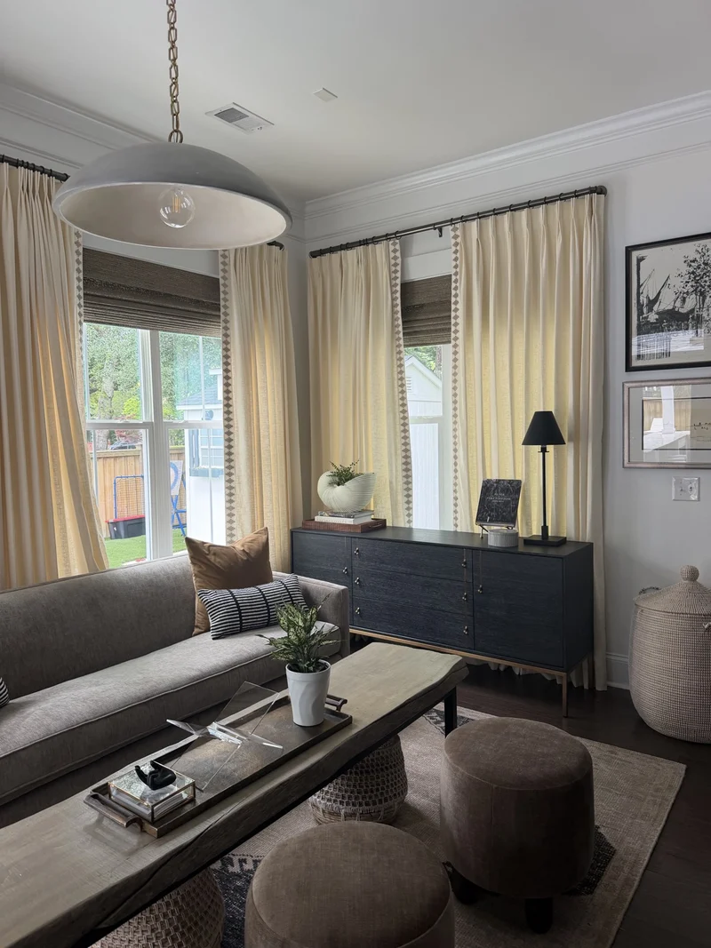 A light-filled sitting room with patterned upholstery and garden views.